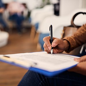 Patient filling out paperwork in lobby