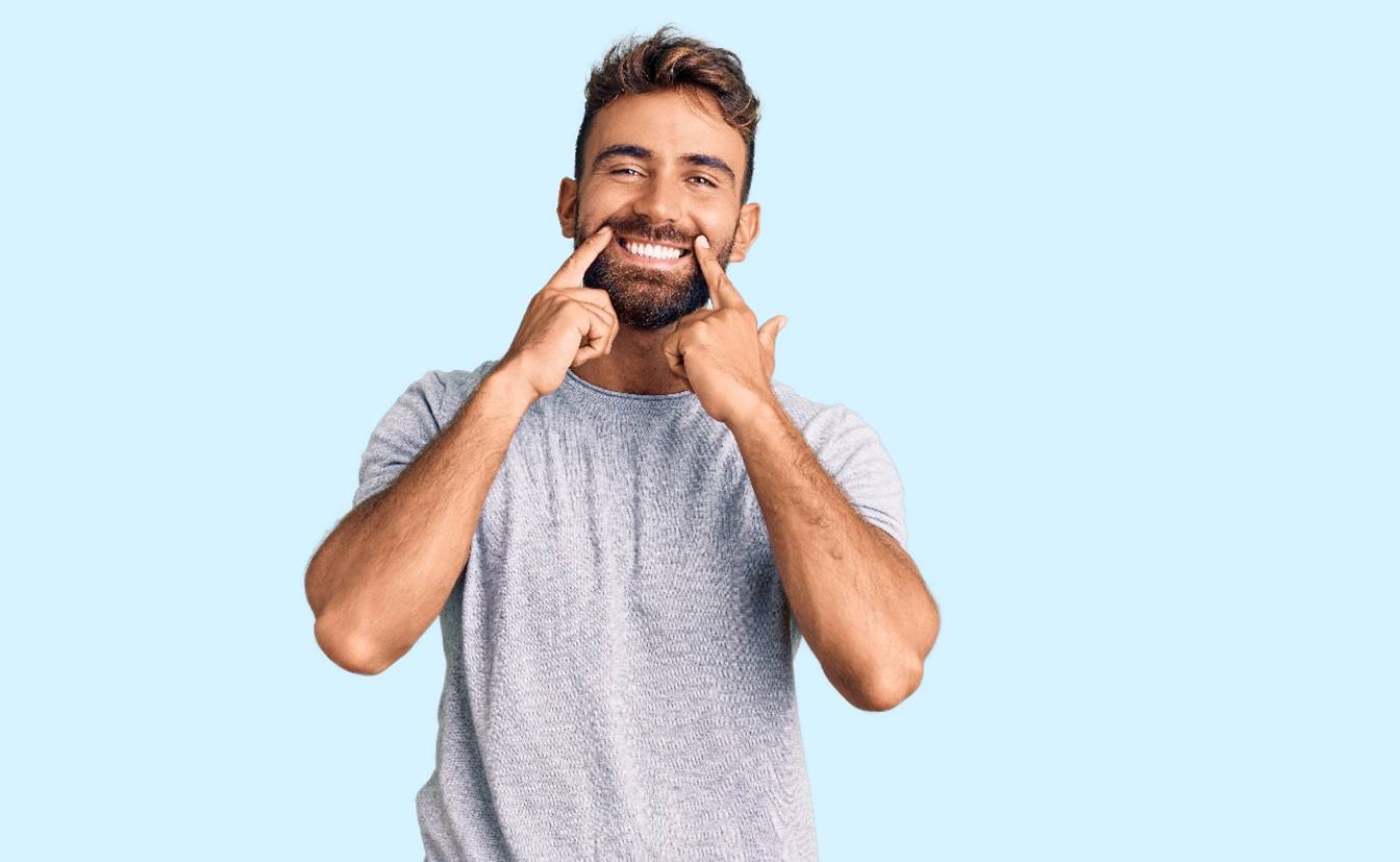 a patient showing off his whitened smile