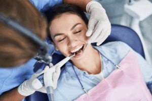 a person smiling during a dental checkup